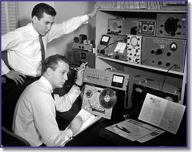 Barry (seated) and friend, Richard Somers, editing an in-flight tape recording
